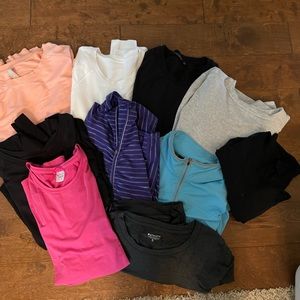 Bundle of 10 Athleta sweatshirts and pullovers.